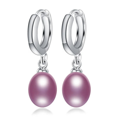 Elegant sterling silver pearl dangle earrings featuring natural freshwater pearls, showcased on a white background.