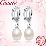 Elegant freshwater pearl dangle earrings with 925 sterling silver settings, perfect for women's daily or occasion wear.