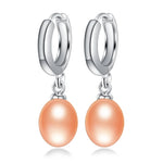 Elegant pearl dangle earrings with 925 sterling silver hoops and soft peach freshwater pearls