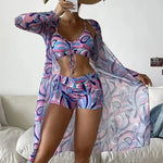 Stylish abstract print tankini swimsuit set with a crop top and high-waisted shorts, perfect for beach or pool wear.