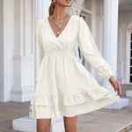 Elegant white chiffon dress with V-neck, ruffle details, and long puffy sleeves from the fashion brand laneberg.