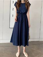 Elegant navy blue maxi dress from Laneberg. Sleeveless design with a cinched waist and lightweight, flowing fabric. Versatile summer dress suitable for casual or evening wear.