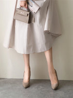 Elegant cream midi dress, tan leather handbag, beige high heels - stylish women's fashion.