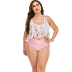 Floral print plus size women's swimsuit with pink bikini bottoms. Stylish beachwear with a crop top design. High-quality swimwear made for the modern woman.