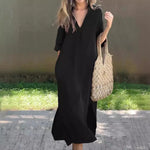 Elegant Black Kaftan Dress with Crocheted Tote Bag on Grassy Background